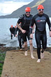 That's me in the shortie. I may have been smiling, but a few minutes later I realised my wetsuit had conspired to saw my head off at the neck. I particularly love the guy at the back... not sure what's going on there!